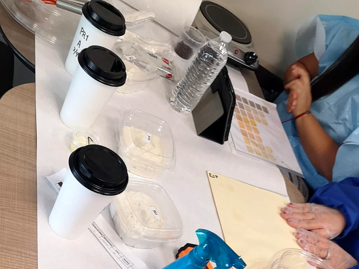 Market Research in Central America Product evaluation setup with sample containers, tablet and evaluation materials